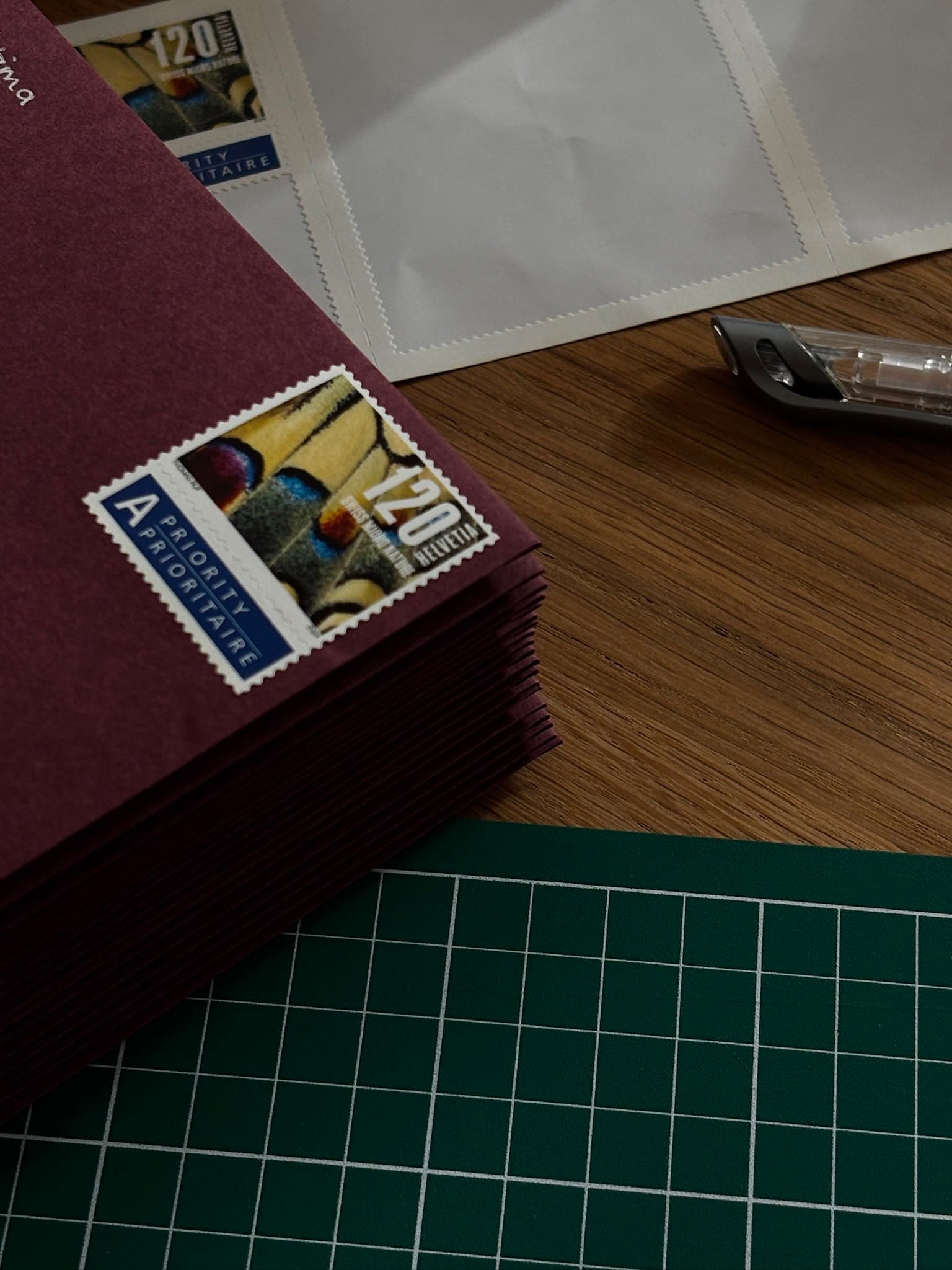 A stack of envelopes, stamped and ready to be mailed