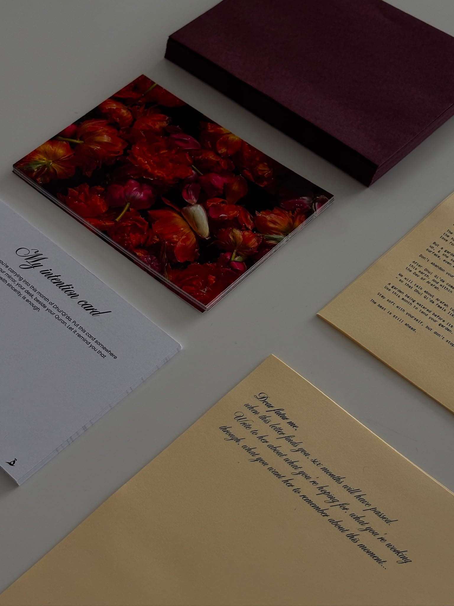 A monthly card alongside an intention card and a handwritten letter